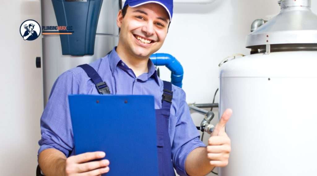 A smiling plumber gives a thumbs-up while holding a clipboard in front of a water heater, indicating a successful inspection or repair.

